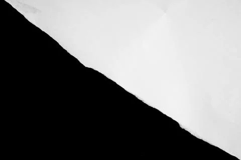 Close up of a white ripped or torn piece of paper with copy space. Stock Photos