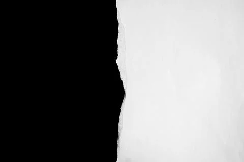 Close up of a white ripped or torn piece of paper with copy space. Stock Photos