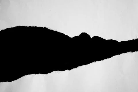 Close up of a white ripped or torn piece of paper with copy space. 스톡 사진