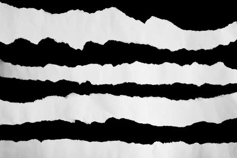 Close up of a white ripped or torn piece of paper with copy space. Stock Photos