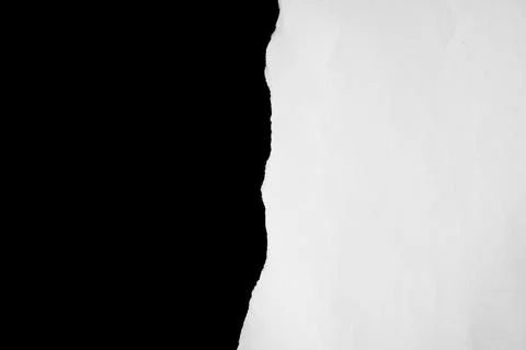 Close up of a white ripped or torn piece of paper with copy space. Stock Photos