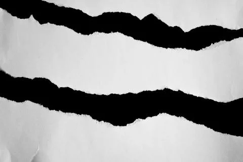 Close up of a white ripped or torn piece of paper with copy space. Foto stock