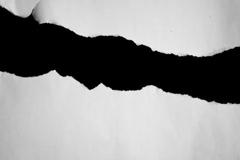 Close up of a white ripped or torn piece of paper with copy space. Stock Photos