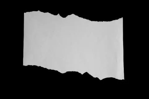 Close up of a white ripped or torn piece of paper with copy space. Stock Photos