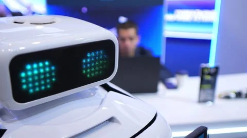 Close-up of a white robot with green pixelated eyes Stock Footage 344992446