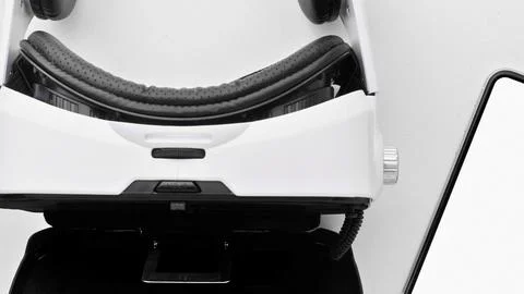 Close up of a white robot with a smiling face and a tablet Stock Photos