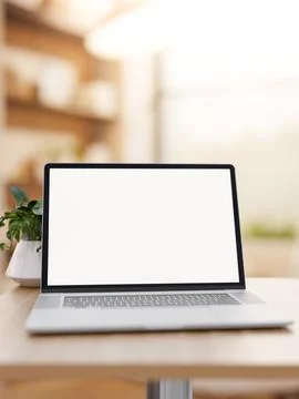 Close up of white screen laptop and potted plant on wooden stool table in c.. イラスト素材