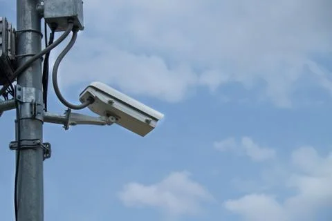 Close up of white security camera and white sky Stock-Fotos
