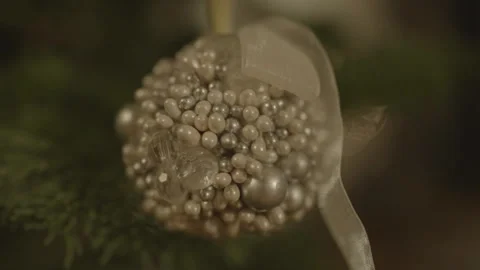 Close-up of white silver beaded Christmas ball on tree Stock Footage 334031092