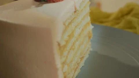 Close-up. White slice of sponge cake with strawberries and cream. Rotation and Video stock 144938985