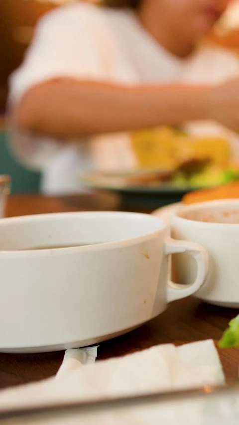 Close Up of White Soup Bowls on Table in Restaurant Setting Stock Footage 335924071