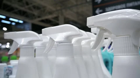 Close-up of white sprayers on plastic jars of household Stock Footage 304987571