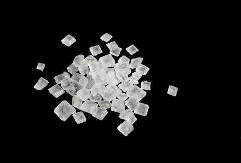 Close up of white sugar crystals isolated Stock Photos