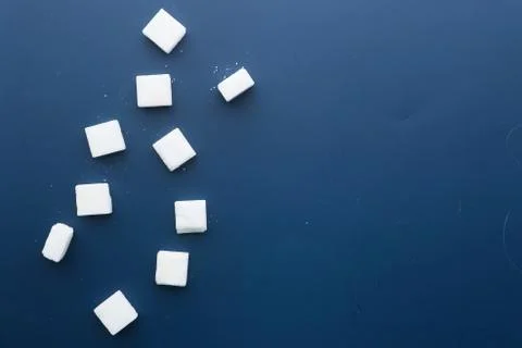 Close up of white sugar cube on color background Stock Photos