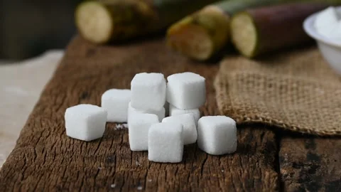 Close up of white sugar cubes. sugar cube on the wooden background 動画素材 345069254