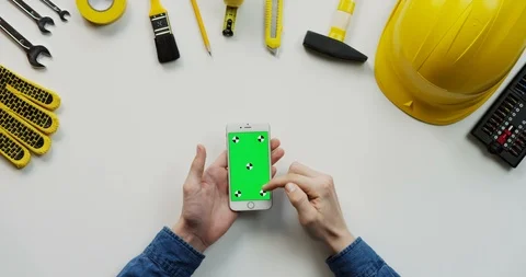 Close up of the white table with building instruments on which man's Caucasian Stock-Footage 96037452