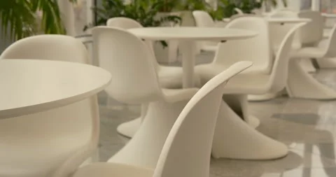 Close Up White Tables and Chairs in Cafe Interior Cinematic Style Stock Footage 332469918