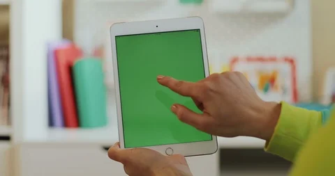 Close up of the white tablet computer with green screen in hands of the woman Stock Footage 104210058