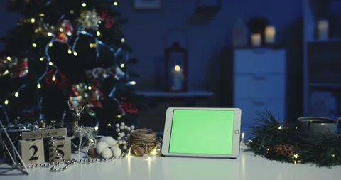 Close up of the white tablet device with alpha channel screen being horizontally Stock-Footage 99809891