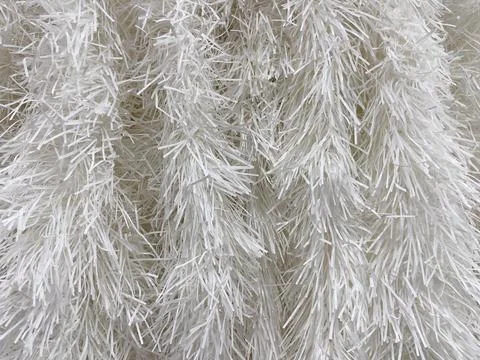 Close-up of white tinsel texture. Abstract background for design. Stock Photos