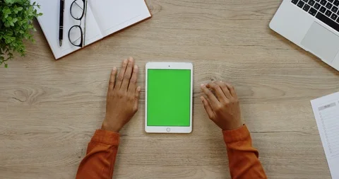 Close up of the white verical tablet computer being on the light wooden desk of Stock Footage 96006478