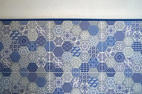 Close up White wall with Blue hexagonal wall tiles texture and surface Stock Photos