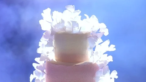 Close-up of white wedding cake with flowers. Stock Footage 80210399