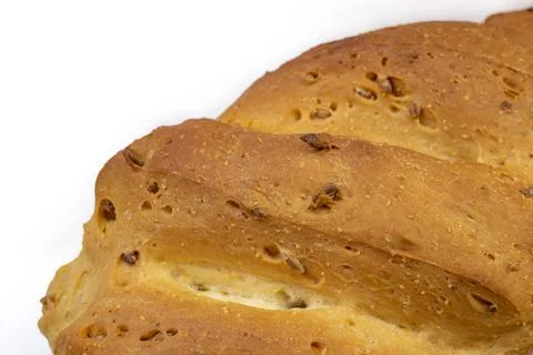 Close up of a white wheat bread crust with sunflower seeds on white backgroun Stock Photos