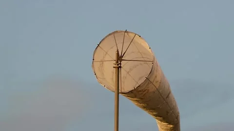 Close Up of a White Wind Sock Swaying Against Blue Sky Stock Footage 329606123