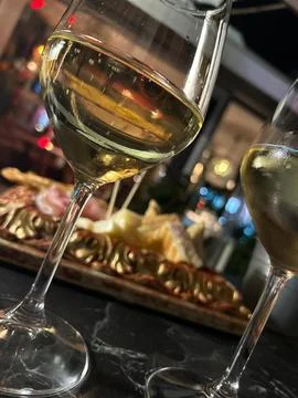 Close-up of white wine glasses on a table Stock Photos