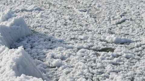 Close-up of white winter sea slush ice with textured frozen surface in cold.. Stockbeeldmateriaal 331203148