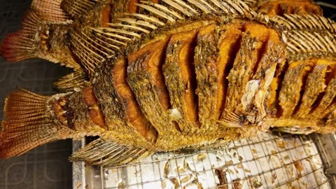 Close Up of Whole Crispy Deep Fried Fish with Golden Crunchy Skin. 4K Видео 340206165