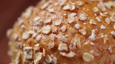 Close-up of Whole grain bread rotate in slow motion Stock Footage 143001233
