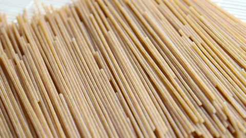 Close up whole wheat spaghetti, uncooked pasta Stock Footage 151248111