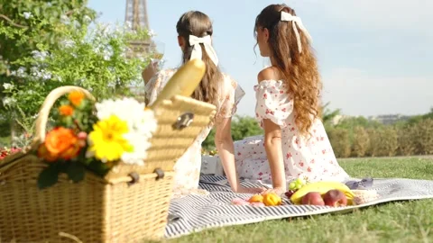 Close Up Of A Wicker Picnic Basket Filled With Flowers And Bread Stock Footage 341549778