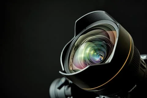 Close-up of wide angle lens in a dsl camera with a black background Photos