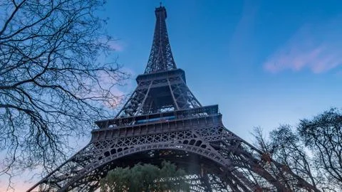Close up wide angle view of the Eiffel tower in Paris at sunset Stock Photos