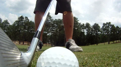 Close-up wide-angle view of golf ball being hit Видео 34671287