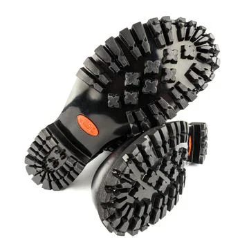 Close-up wide angle view of new boots mini lugs black rubber outsole with 120 库存照片