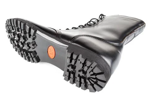 Close-up wide angle view of new boot mini lugs black rubber outsole with 120 Photos
