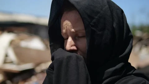 Close-up of the widow's face in mourning clothes, she is in a state of grief. A Stock Footage 217415081