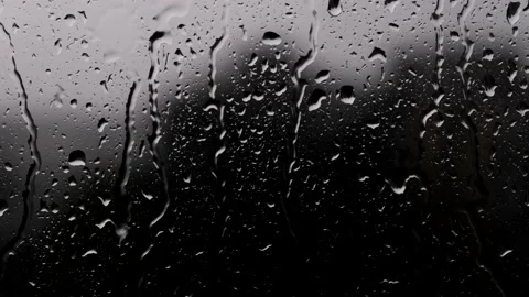 Close Up Wiew Of Drops Of Rain Trickling Down On Black Background Stock Footage 216994294