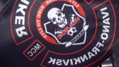 Close-up of a WILD BIKE patch with a skull emblem Stock Footage 317952358