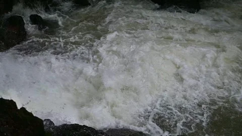Close up of wild river rapids, strong water current splashing against stones. Stock Footage 338378634