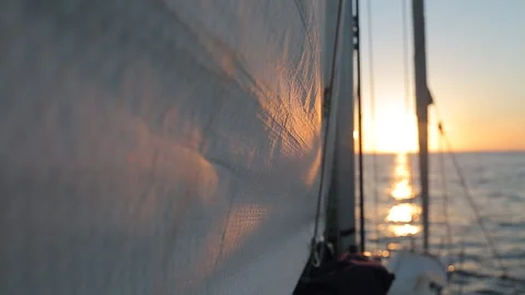 Close up of Wind Filled Sail on Yacht at Sunset in Corsica Stock Footage 340339256