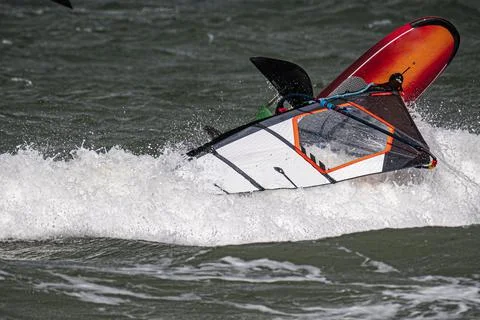 Close up of a wind foil board capsized in a wave Stock Photos