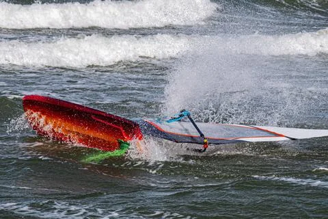 Close up of a wind foil board capsized in a wave Stock Photos