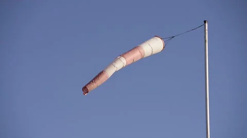 Close up of wind sock air sleeve moving in the wind and blue sky Stock Footage 65519106