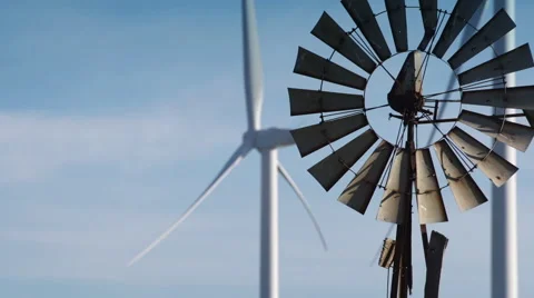 Close Up of Wind Turbine Farm & Old Farm Windmill Stock Footage