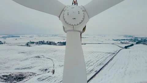 Close up wind turbine generating clean renewable energy in cold frozen snowy Stock Footage 227359123